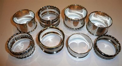 Lot 175 - Seven assorted silver napkin rings and a plated example