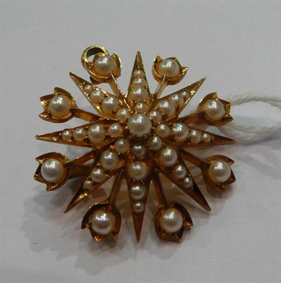 Lot 185 - A seed pearl set star brooch