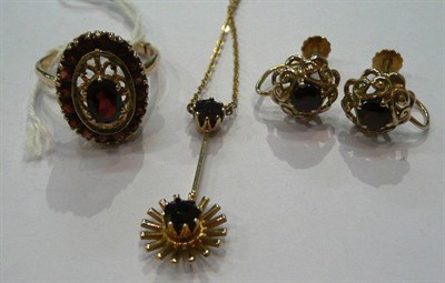 Lot 187 - A garnet ring, pair of earrings and pendant on a chain