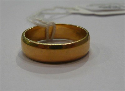 Lot 188 - An 18ct gold band ring