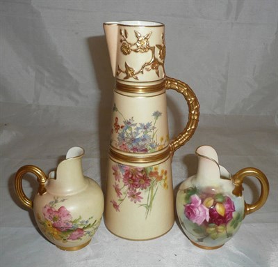 Lot 210 - A Royal Worcester jug painted with flowers by E M Fildes, a blush ivory jug and a ewer