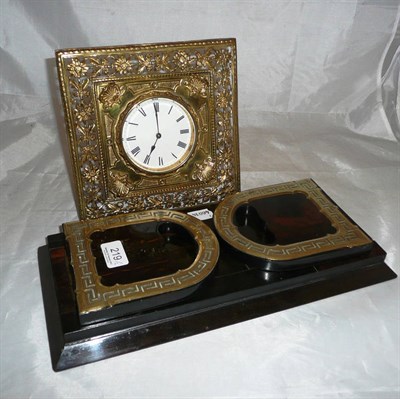 Lot 219 - A brass strutt clock and a brass mounted coromandel book slide