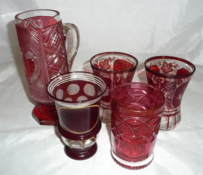 Lot 220 - A Bohemian cut glass mug and four glasses