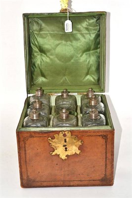 Lot 958 - A Spanish Leather Decanter Box, 19th century, of square form with foliate and strapwork decoration