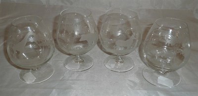 Lot 249 - A set of four brandy balloons, cut and etched with African wild animals in the manner of Roland...