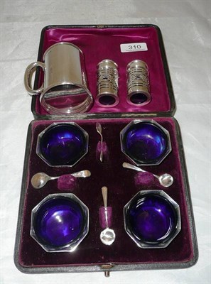 Lot 310 - A set of four cased salts, spoons, two pepperettes and a christening mug