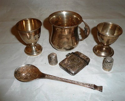 Lot 311 - Small silver cup, two egg cups, two thimbles, a spoon and a vesta case