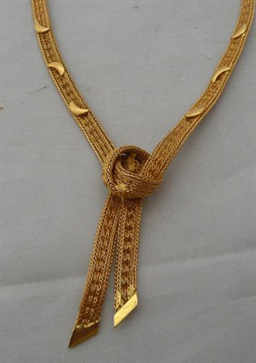 Lot 315 - A mesh knot link necklace with moon decoration