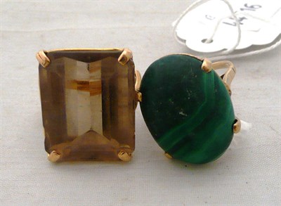 Lot 319 - A smokey quartz ring and a malachite ring