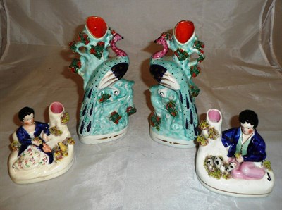 Lot 327 - Pair of Staffordshire peacocks and a pair of Staffordshire figures of children