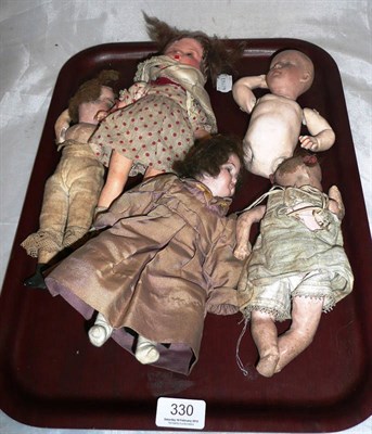 Lot 330 - Four assorted small bisque socket head dolls and a composition doll (5)