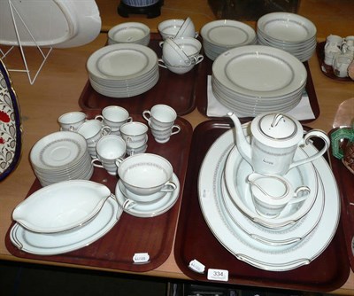 Lot 334 - Noritake coffee pot and lid, cream jug, twelve cups and saucers, and a Noritake dinner service