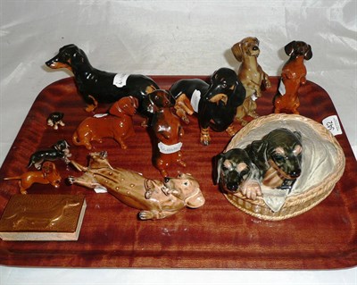 Lot 342 - Eleven ceramic dashunds including Doulton, Beswick and Coalport ? Plus one copper vesta case