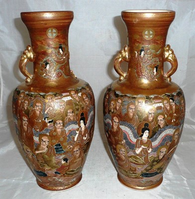 Lot 344 - A pair of Japanese Satsuma earthenware vases decorated with 'Grim Faced Immortals' (a.f.)