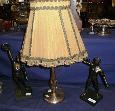 Lot 362 - A silver lamp base and shade and two figures