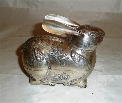 Lot 363 - An Asian white metal figure in the form of a rabbit