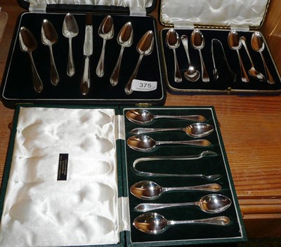 Lot 375 - Two sets of silver spoons and tongs and a set of grapefruit spoons cased