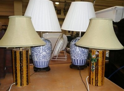 Lot 410 - A pair of blue and white lamps and a pair of simulated bamboo vase lamps