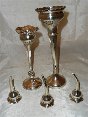 Lot 434 - Two small silver vases and three posy holders