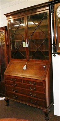 Lot 522 - A Waring & Gillow mahogany bureau bookcase