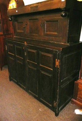 Lot 524 - An 18th century oak court cupboard with carved date '1715'