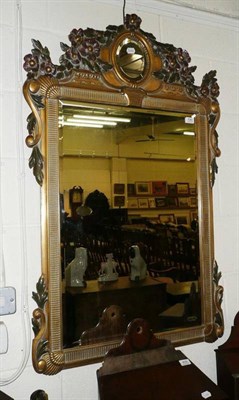 Lot 530 - A decorative gilt wall mirror