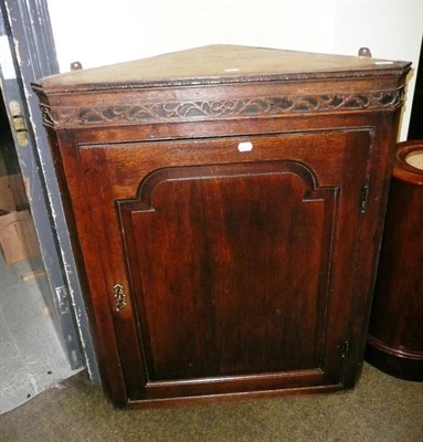 Lot 544 - 18th century oak corner cupboard