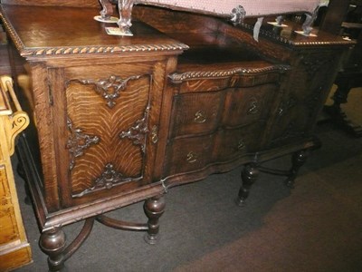 Lot 547 - A carved oak sideboard