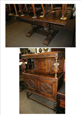 Lot 556 - A carved oak court cupboard and a carved oak dining table