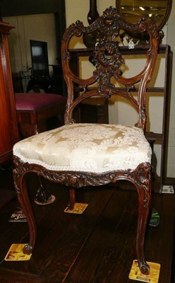 Lot 557 - A carved mahogany side chair