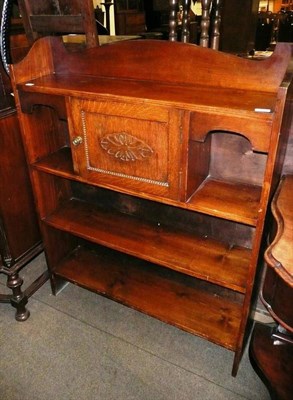 Lot 562 - A stained pine bookcase