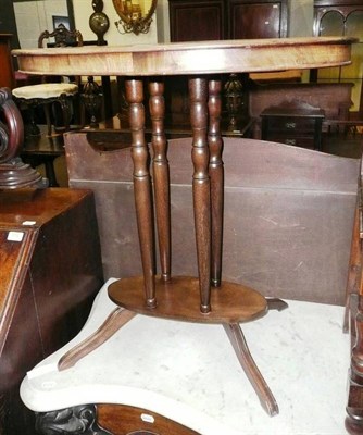 Lot 573 - A mahogany and satinwood banded oval table (faded)