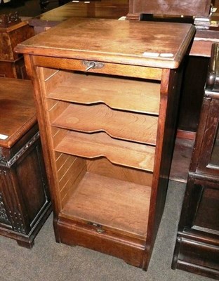 Lot 580 - Small oak cabinet with tambour front and key