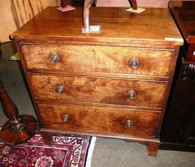 Lot 588 - A George III mahogany three drawer chest of drawers