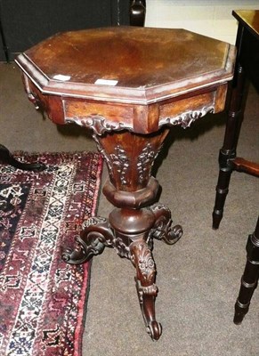 Lot 593 - A Victorian rosewood sewing table