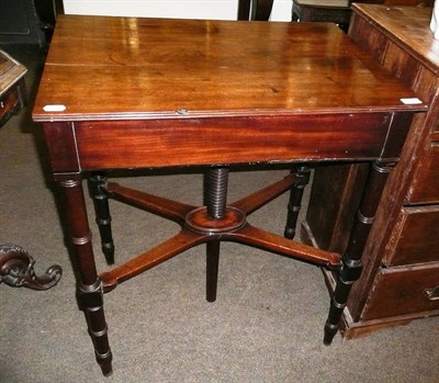 Lot 594 - A mahogany table, the top rising on a turned wooden screw thread