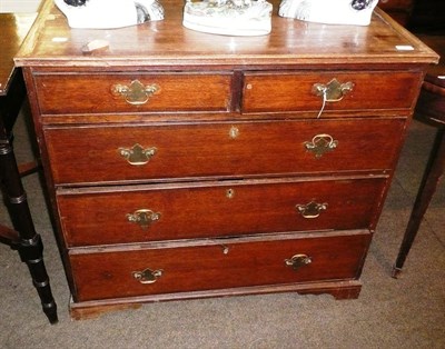 Lot 595 - A Georgian oak small four height chest of drawers