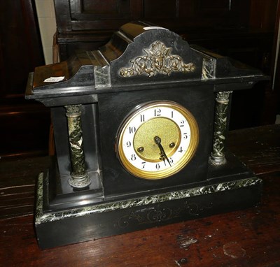 Lot 598 - A black slate mantel clock and key