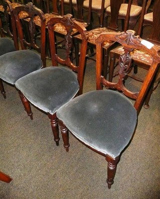 Lot 610 - A set of six carved walnut salon chairs