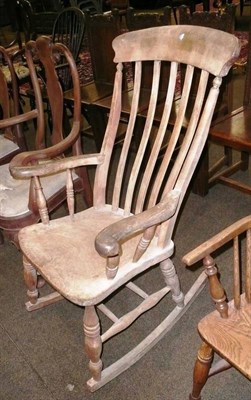 Lot 614 - A country kitchen rocking chair