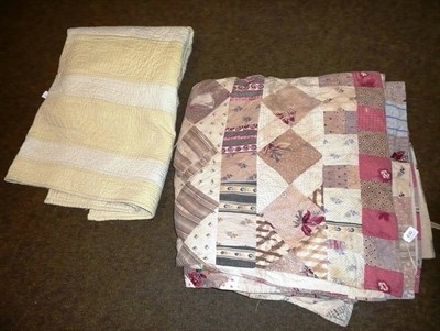 Lot 630 - Patchwork quilt and a yellow striped Durham quilt (2)