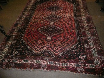 Lot 631 - A Shiraz rug South West Persia  The stepped lozenge field with three medallions enclose by multiple