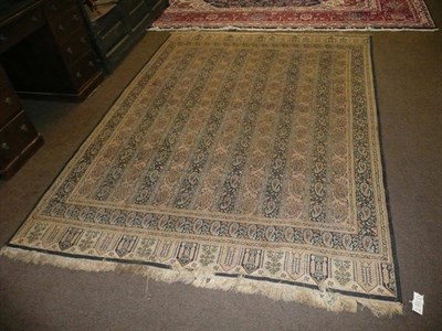 Lot 633 - A Kashmir rug North West India The field with narrow columns of boteh enclosed by similar...