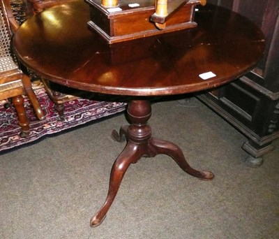 Lot 640 - A mahogany tripod table with tilt top