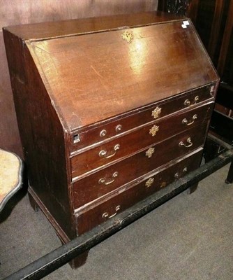 Lot 657 - A Georgian oak bureau