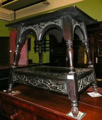 Lot 659 - Carved oak two tier table