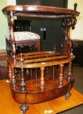 Lot 661 - A walnut Canterbury