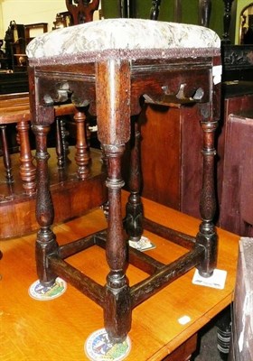 Lot 666 - An 18th century style oak bar stool