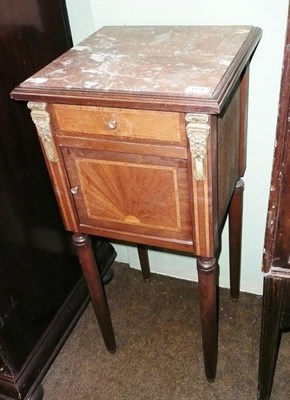 Lot 674 - A 19th century French inlaid mahogany bedside cupboard with rouge marble top and marble lining