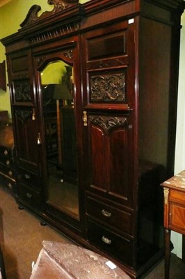 Lot 675 - A late Victorian carved mahogany wardrobe